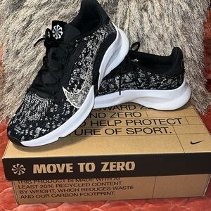 Metallic silver, and black Nike sneakers